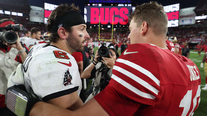 Tampa Bay Buccaneers quarterback Baker Mayfield (6) and San Francisco 49ers quarterback Mac Jones hug following their game.