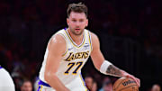 Nov 30, 2025; Los Angeles, California, USA; Los Angeles Lakers guard Luka Doncic (77) moves the ball against the New Orleans Pelicans during the first half at Crypto.com Arena. Mandatory Credit: Gary A. Vasquez-Imagn Images