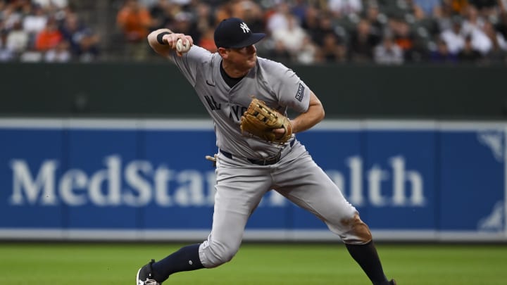 Jul 12, 2024; Baltimore, Maryland, USA; New York Yankees third baseman DJ LeMahieu (26) twos to first base during the first inning against the Baltimore Orioles  at Oriole Park at Camden Yards. Mandatory Credit: Tommy Gilligan-USA TODAY Sports