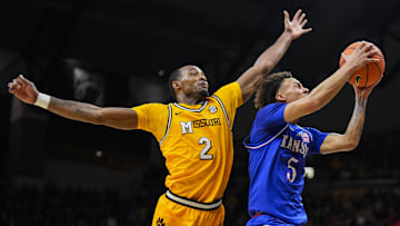 Dec 8, 2024; Columbia, Missouri, USA; Kansas Jayhawks guard Zeke Mayo (5) shoots the ball against Missouri Tigers guard Tamar Bates (2) during the first half at Mizzou Arena. Mandatory Credit: Jay Biggerstaff-Imagn Images