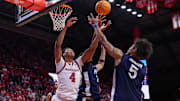 Rutgers Scarlet Knights guard Ace Bailey (4) battles Penn State Nittany Lions guard Puff Johnson (5) for the ball during the second half at Jersey Mike's Arena.