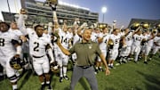 Army Black Knights head coach Jeff Monken celebrates with his players after a win this season.