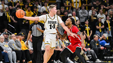 Nov 4, 2025; Iowa City, Iowa, USA; Iowa Hawkeyes guard Bennett Stirtz (14) controls the ball as Robert Morris Colonials guard Ta'Zir Smith (3) defends during the first half at Carver-Hawkeye Arena. Mandatory Credit: Jeffrey Becker-Imagn Images