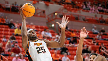 Feb 25, 2025; Stillwater, Oklahoma, USA; Oklahoma State Cowboys forward Robert Jennings II (25) shoots the ball during the first half against the Iowa State Cyclones at Gallagher-Iba Arena. Mandatory Credit: William Purnell-Imagn Images
