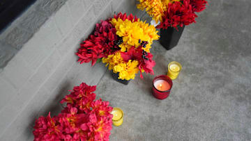 Flowers and candles left outside at the closed Hulk Hogan's Wrestling Shop in Pigeon Forge, Tenn