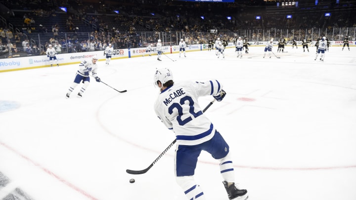 Apr 30, 2024; Boston, Massachusetts, USA; Toronto Maple Leafs defenseman Jake McCabe (22) handles the puck during warmups prior to game five of the first round of the 2024 Stanley Cup Playoffs against the Boston Bruins at TD Garden. Mandatory Credit: Bob DeChiara-USA TODAY Sports