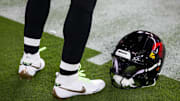 Oct 21, 2024; Glendale, Arizona, USA; Detailed view of the helmet and Nike shoes of Arizona Cardinals quarterback Kyler Murray (1) against the Los Angeles Chargers at State Farm Stadium. Mandatory Credit: Mark J. Rebilas-Imagn Images