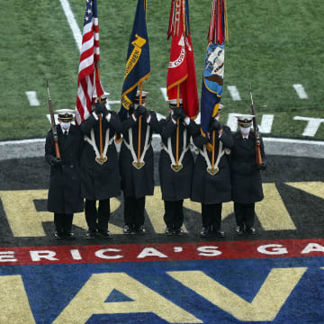 Dec 12, 2020; West Point, New York, USA; The Naval Academy color guard stands on the midfield logo before a game between the Army Golden Knights and the Navy Midshipmen at Michie Stadium. Mandatory Credit: Danny Wild-USA TODAY Sports