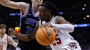 Mar 22, 2025; Denver, CO, USA; Wisconsin Badgers guard John Blackwell (25) dribbles the ball against the Brigham Young Cougars during the first half in the second round of the NCAA Tournament at Ball Arena. 