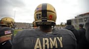 Oct 22, 2016; West Point, NY, USA; An Army Black Knights player wearing a helmet decal honoring defensive back Brandon Jackson (28) watches a game from the sidelines during the second half against the Army Black Knights at Michie Stadium. Jackson was killed in a car crash on Sept. 11, 2016.