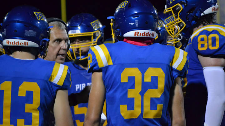 Crystal River head coach Bill Vonada talks with his offense during a timeout in an Oct. 4, 2024 home game against The Villages. 
