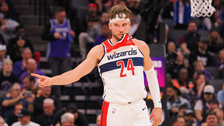 Dec 18, 2023; Sacramento, California, USA; Washington Wizards forward Corey Kispert (24) with part of his jersey in his mouth between plays against the Sacramento Kings during the third quarter at Golden 1 Center. Mandatory Credit: Kelley L Cox-USA TODAY Sports