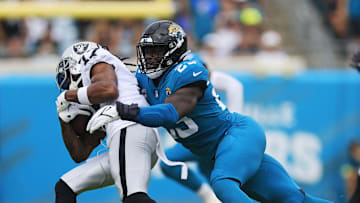 Jacksonville Jaguars linebacker Foyesade Oluokun (23) tackles Las Vegas Raiders wide receiver Davante Adams (17) during the first quarter of a regular season NFL football matchup Sunday, Nov. 6, 2022 at TIAA Bank Field in Jacksonville. The Jacksonville Jaguars held off the Las Vegas Raiders 27-20. [Corey Perrine/Florida Times-Union]

Jki 110622 Raiders Jags Cp 50