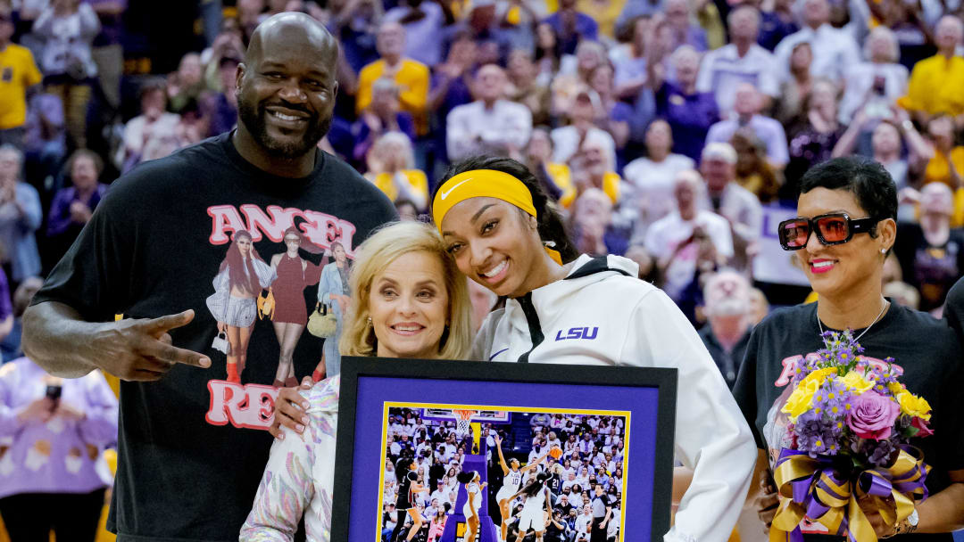 Mar 3, 2024; Baton Rouge, Louisiana, USA; LSU Lady Tigers forward Angel Reese takes a photo for senior night with former LSU player and NBA champion Shaquille O'Neal, LSU Lady Tigers head coach Kim Mulkey, and Reese’s mother Angel Webb against the Kentucky Wildcats at Pete Maravich Assembly Center. Mandatory Credit: Matthew Hinton-USA TODAY Sports