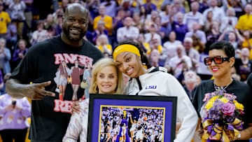 LSU Lady Tigers forward Angel Reese takes a photo for senior night with former LSU player and NBA champion Shaquille O'Neal.