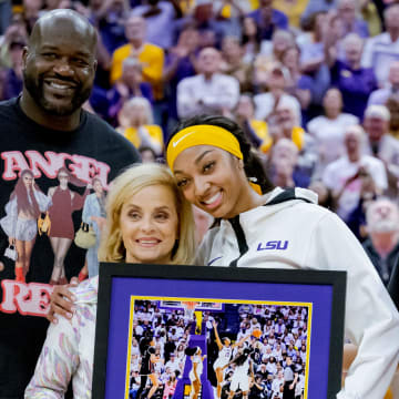 Mar 3, 2024; Baton Rouge, Louisiana, USA; LSU Lady Tigers forward Angel Reese takes a photo for senior night with former LSU player and NBA champion Shaquille O'Neal, LSU Lady Tigers head coach Kim Mulkey, and Reese’s mother Angel Webb against the Kentucky Wildcats at Pete Maravich Assembly Center. Mandatory Credit: Matthew Hinton-USA TODAY Sports
