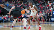 Mar 10, 2022; Las Vegas, NV, USA; Arizona Wildcats guard Bennedict Mathurin (0) dribbles against Stanford Cardinal forward Max Murrell (10) during the first half at T-Mobile Arena. Mandatory Credit: Stephen R. Sylvanie-Imagn Images