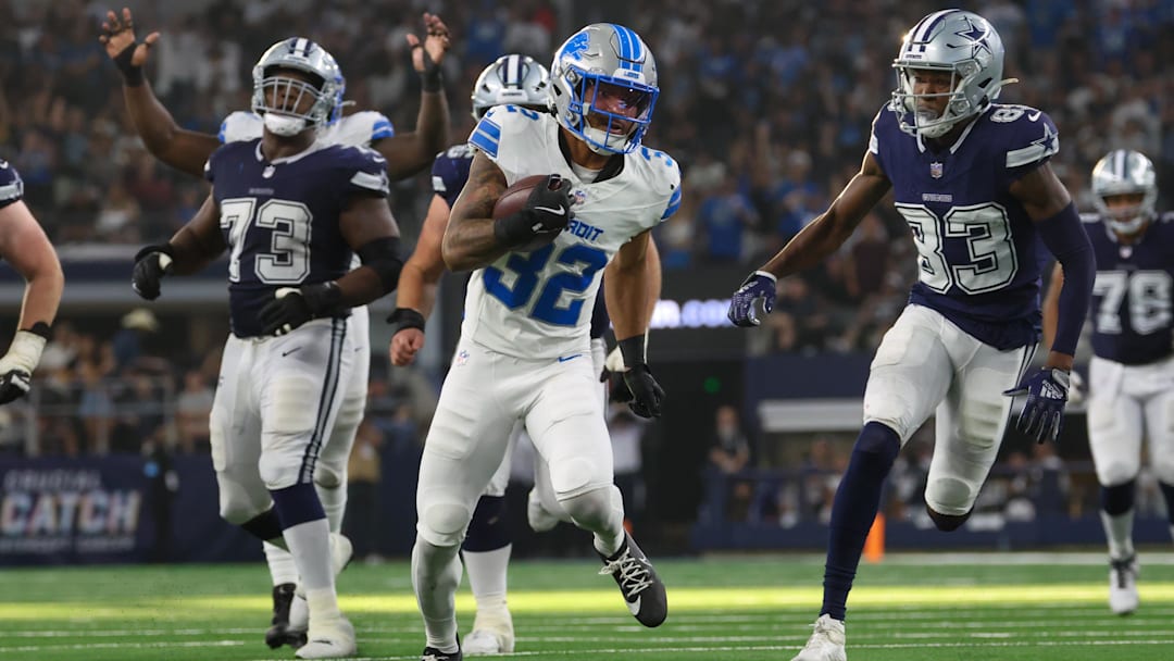 Oct 13, 2024; Arlington, Texas, USA; Detroit Lions safety Brian Branch (32) returns an interception during the second half against the Dallas Cowboys  at AT&T Stadium. Mandatory Credit: Kevin Jairaj-Imagn Images