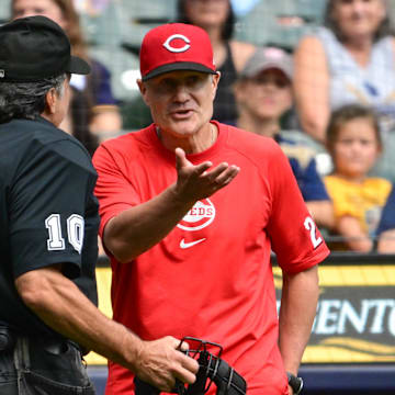 Aug 11, 2024; Milwaukee, Wisconsin, USA;  Cincinnati Reds manager David Bell argues with home plate umpire Phil Cuzzi in the first inning against the Milwaukee Brewers at American Family Field. Mandatory Credit: Benny Sieu-Imagn Images