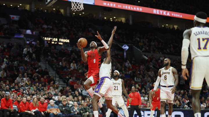 Jan 22, 2023; Portland, Oregon, USA; Portland Trail Blazers small forward Jerami Grant (9) is fouled while shooting by Los Angeles Lakers center Thomas Bryant (31) during the second half at Moda Center. Mandatory Credit: Soobum Im-USA TODAY Sports
