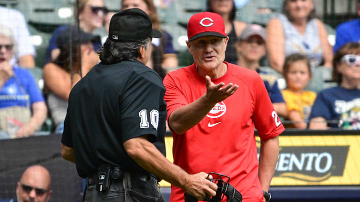 Aug 11, 2024; Milwaukee, Wisconsin, USA;  Cincinnati Reds manager David Bell argues with home plate umpire Phil Cuzzi in the first inning against the Milwaukee Brewers at American Family Field. Mandatory Credit: Benny Sieu-Imagn Images