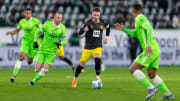 Marco Reus (centre) led Borussia Dortmund to a 3-1 win over Wolfsburg in November