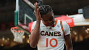 Jan 11, 2025; Coral Gables, Florida, USA; Miami Hurricanes guard Paul Djobet (10) reacts after driving to the basket against the Wake Forest Demon Deacons during the first half at Watsco Center. Mandatory Credit: Sam Navarro-Imagn Images