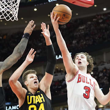 Utah Jazz forward John Collins (20)  and center Walker Kessler (24) defend against Chicago Bulls guard Josh Giddey (3) during the second half at United Center. Mandatory Credit: David Banks-Imagn Images