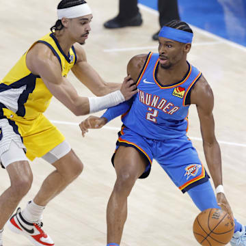 Jun 22, 2025; Oklahoma City, Oklahoma, USA; Oklahoma City Thunder guard Shai Gilgeous-Alexander (2) controls the ball againstIndiana Pacers guard Andrew Nembhard (2) during the first half of game seven of the 2025 NBA Finals at Paycom Center. Mandatory Credit: Alonzo Adams-Imagn Images