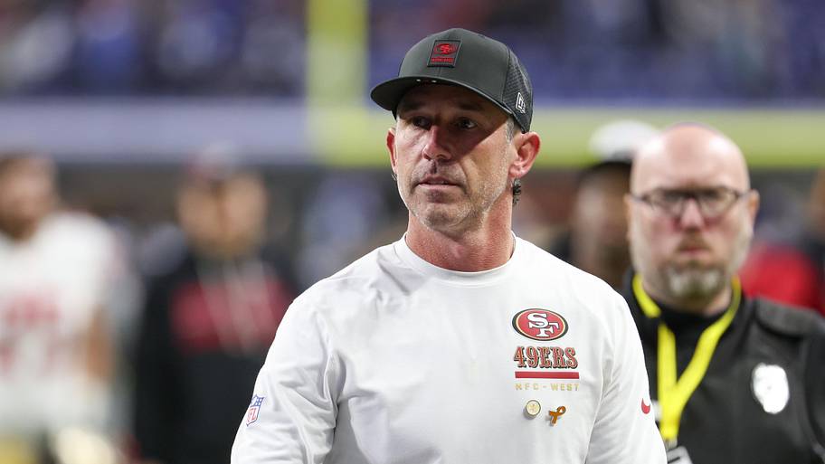 Kyle Shanahan on the field after a game.