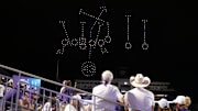 Fans watch a drone show following the game against Kansas.