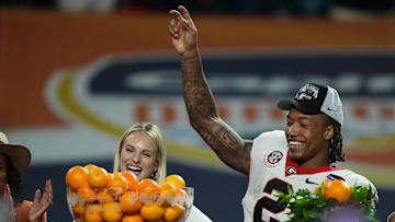 Dec 30, 2023; Miami Gardens, FL, USA; Georgia Bulldogs running back Kendall Milton (2) reacts after