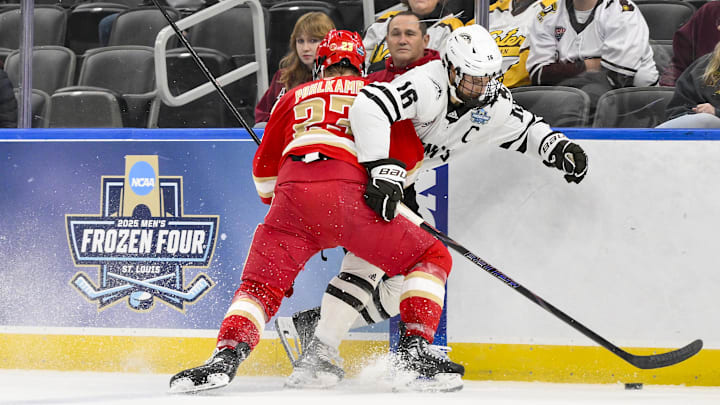Apr 10, 2025; St. Louis, Missouri, UNITED STATES; Western Michigan Broncos forward Tim Washe (16) and Denver Pioneers defenseman Eric Pohlkamp (23) battle for the puck during the second period of the Frozen Four college ice hockey national semifinals at Enterprise Center. Mandatory Credit: Jeff Curry-Imagn Images Apr 10, 2025; St. Louis, Missouri, UNITED STATES; Western Michigan Broncos forward Tim Washe (16) and Denver Pioneers defenseman Eric Pohlkamp (23) battle for the puck during the second period of the Frozen Four college ice hockey national semifinals at Enterprise Center. Mandatory Credit: Jeff Curry-Imagn Images