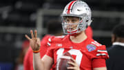 Dec 29, 2017; Arlington, TX, USA; Ohio State Buckeyes quarterback Joe Burrow (10) throws prior to the game against the Southern California Trojans in the 2017 Cotton Bowl at AT&T Stadium. Mandatory Credit: Matthew Emmons-USA TODAY Sports