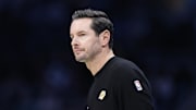 Nov 10, 2025; Charlotte, North Carolina, USA; Los Angeles Lakers Head Coach JJ Redick watches from the sideline during the first quarter against the Charlotte Hornets at Spectrum Center. Mandatory Credit: Brian Westerholt-Imagn Images