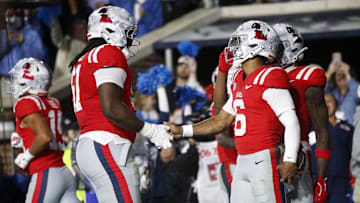 Nov 1, 2025; Oxford, Mississippi, USA; Mississippi Rebels quarterback Trinidad Chambliss (6) reacts with Mississippi Rebels offensive lineman Diego Pounds (61) after a touchdown during the second quarter against the South Carolina Gamecocks at Vaught-Hemingway Stadium. Mandatory Credit: Petre Thomas-Imagn Images