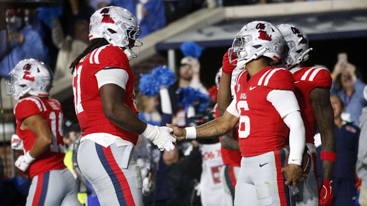 Nov 1, 2025; Oxford, Mississippi, USA; Mississippi Rebels quarterback Trinidad Chambliss (6) reacts with Mississippi Rebels offensive lineman Diego Pounds (61) after a touchdown during the second quarter against the South Carolina Gamecocks at Vaught-Hemingway Stadium. Mandatory Credit: Petre Thomas-Imagn Images