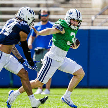 BYU quarterback McCae Hillstead and defensive end Ephraim Asiata at Fall Camp scrimmage