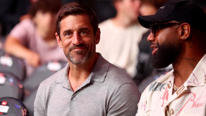 Jun 29, 2024; Las Vegas, Nevada, USA; New York Jets quarterback Aaron Rodgers and Chicago Bears tight end Marcedes Lewis during UFC 303 at T-Mobile Arena.