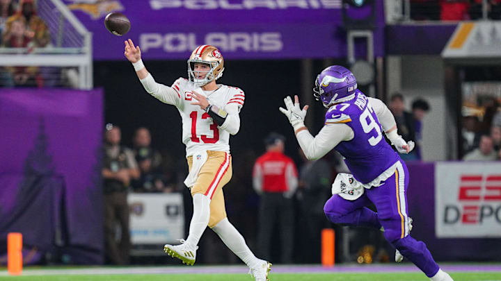 Oct 23, 2023; Minneapolis, Minnesota, USA; San Francisco 49ers quarterback Brock Purdy (13) passes against the Minnesota Vikings defensive tackle Harrison Phillips (97) in the fourth quarter at U.S. Bank Stadium.