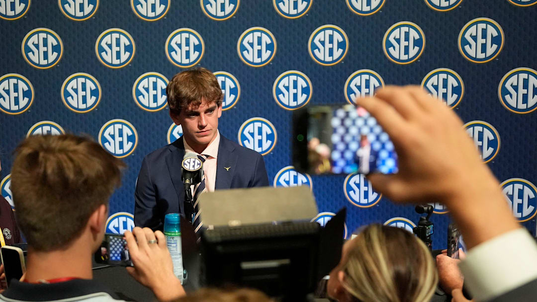 Texas quarterback Arch Manning listens to a question during SEC Media Days at the College Football Hall of Fame in Atlanta.