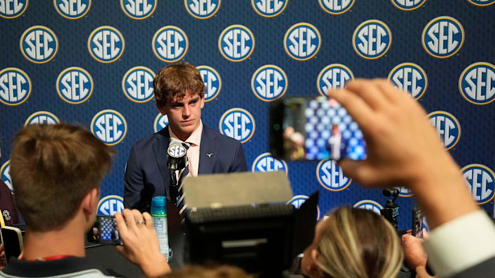 Texas quarterback Arch Manning listens to a question during SEC Media Days at the College Football Hall of Fame in Atlanta.