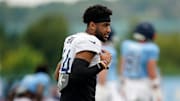 Tennessee Titans safety Mike Brown stretches during an NFL training camp practice at Ascension Saint Thomas Sports Park 