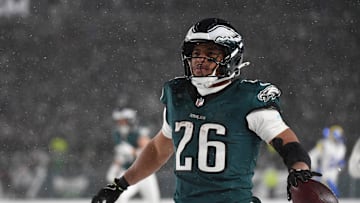 Jan 19, 2025; Philadelphia, Pennsylvania, USA; Philadelphia Eagles running back Saquon Barkley (26) celebrates after scoring a touchdown against the Los Angeles Rams in the second half in a 2025 NFC divisional round game at Lincoln Financial Field. Mandatory Credit: Eric Hartline-Imagn Images
