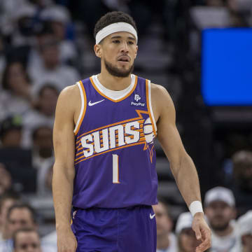 Apr 20, 2024; Minneapolis, Minnesota, USA; Phoenix Suns guard Devin Booker (1) looks on against the Minnesota Timberwolves in the first half during game one of the first round for the 2024 NBA playoffs at Target Center. Mandatory Credit: Jesse Johnson-USA TODAY Sports