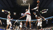 Mar 22, 2024; Portland, Oregon, USA; LA Clippers forward Paul George (13) goes up for a dunk against Portland Trail Blazers center Moses Brown (10).