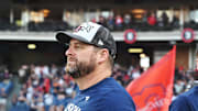 Sep 28, 2025; Cleveland, Ohio, USA;  Cleveland Guardians manager Stephen Vogt (12) watches the flag raising after the Guardians beat the Texas Rangers and won the American League Central Division at Progressive Field. Mandatory Credit: Ken Blaze-Imagn Images