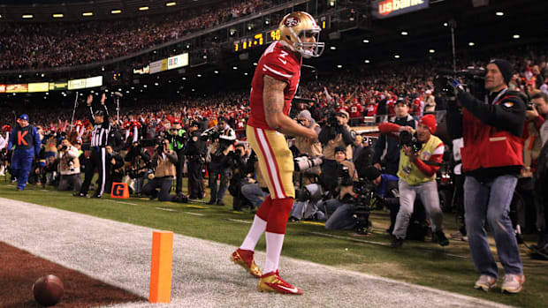 San Francisco 49ers Colin Kaepernick celebrates his touchdown run during the first quarter at Candlestick Park.