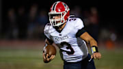 Heritage Hills' Jett Goldsberry (3) carries the ball as the Gibson Southern Titans play the Heritage Hills Patriots
