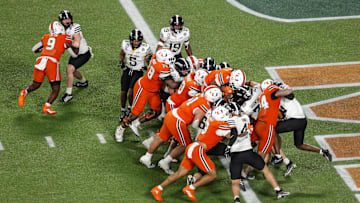 Dec 28, 2024; Orlando, FL, USA; Miami Hurricanes running back Mark Fletcher Jr. (4) scores a touchdown against the Iowa State Cyclones in the third quarter during the Pop Tarts bowl at Camping World Stadium. Mandatory Credit: Nathan Ray Seebeck-Imagn Images